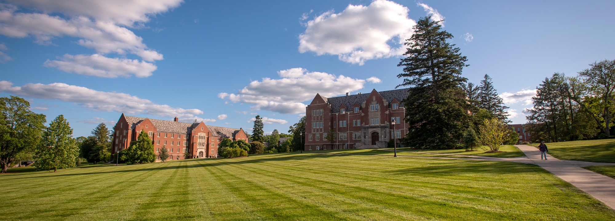 Panoramic view of the great Lawn showing Manchester Hall and the Family Studies building 